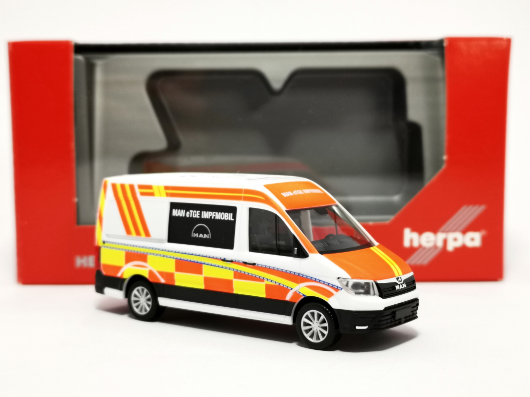 096263 MAN eTGE Bus HD „Corona Impfmobil“ Herpa