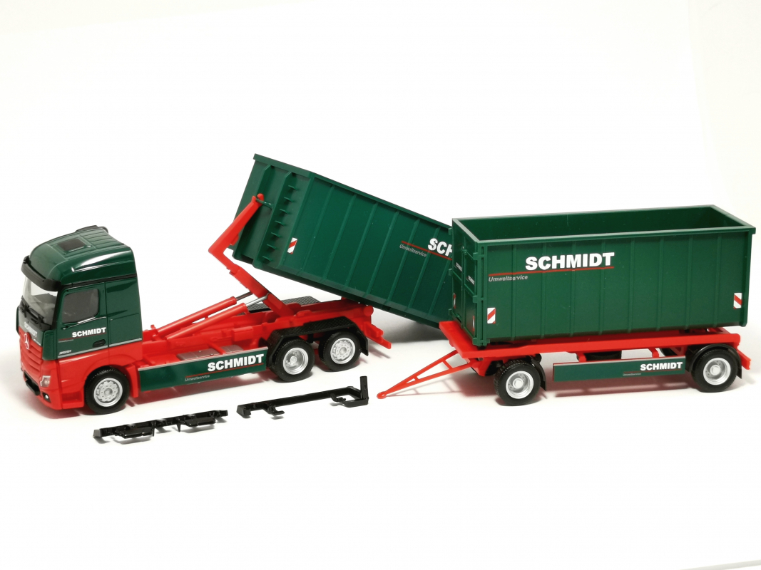Preview: 957557 Mb Actros 18 Abrollmulden-Hängerzug "Schmidt Umweltservice" Herpa - SALE