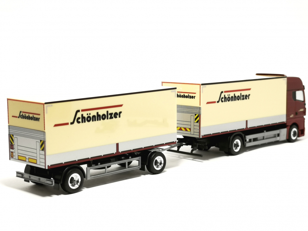 Preview: 962223 MAN TGX GX Koffer-Hängerzug (Pritsche/Plane gedruckt) "Schönholzer" Herpa