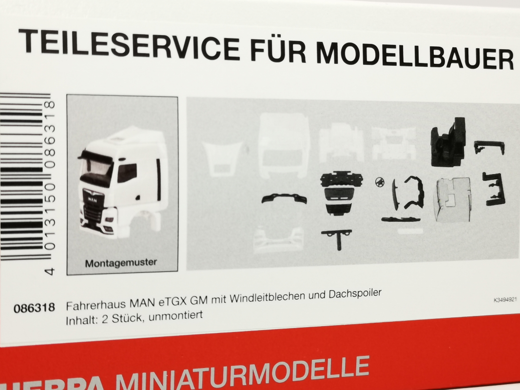 086318 Fahrerhaus MAN eTGX GM mit Windleitblechen und Spiegelkamera, weiß (2 Stück) Herpa