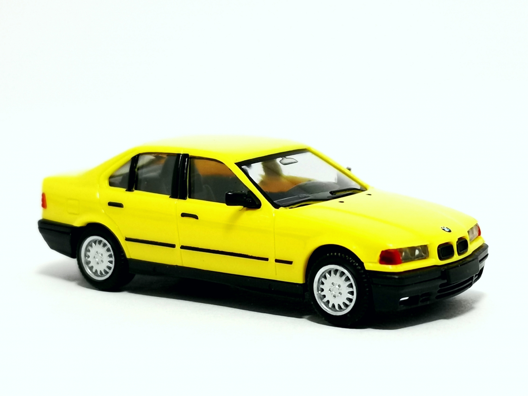 BMW 3er Limousine E36 (1990), gelb Herpa
