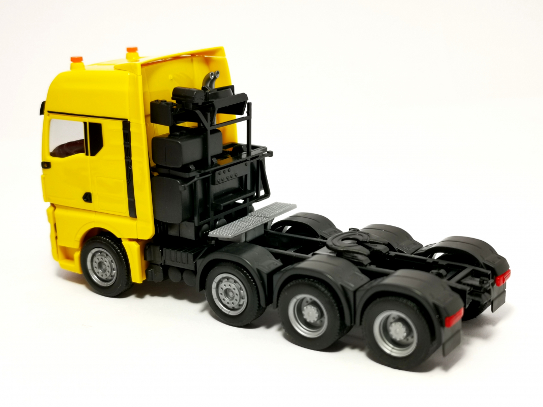 313537 MAN TGX GX Schwerlastzugmaschine, gelb Herpa