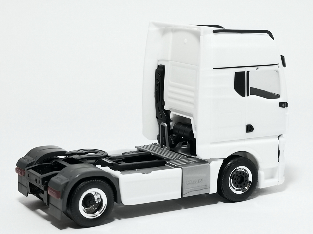 313711-002 MAN TGX GX Individual Zugmaschine, weiß Herpa