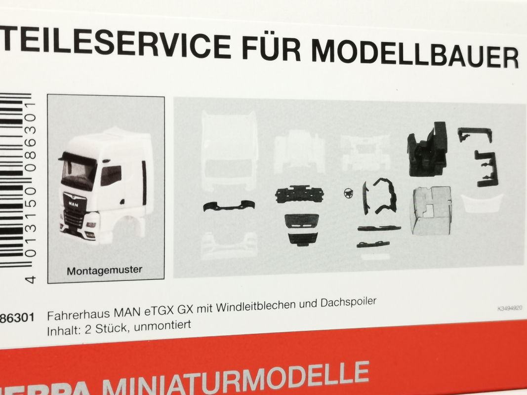 086301 Fahrerhaus MAN eTGX GX mit Windleitblechen und Spiegelkamera, weiß (2 Stück) Herpa