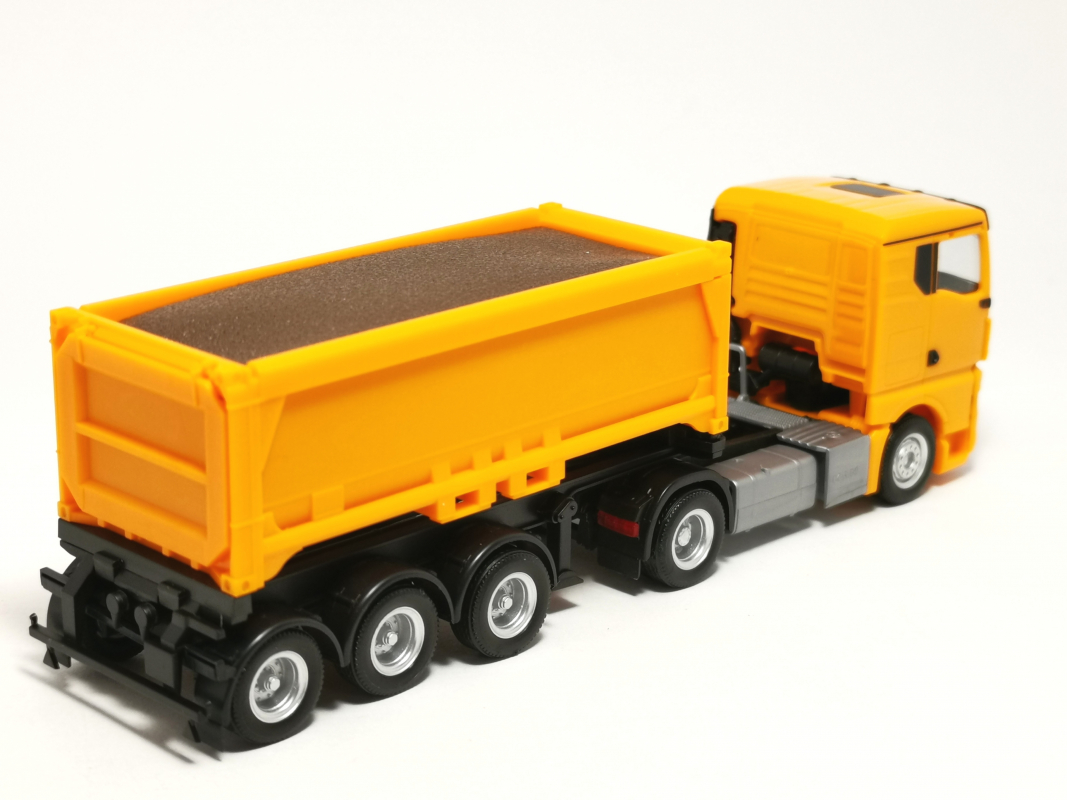 321310 MAN TGX GN Abraummulden-Sattelzug mit Ladegut, kommunalorange Herpa